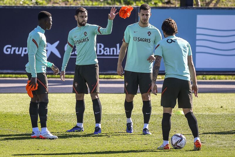 Portugal's midfielder Bruno Fernandes, second left, and teammates attend a training session at the Cidade do Futebol training camp. AFP