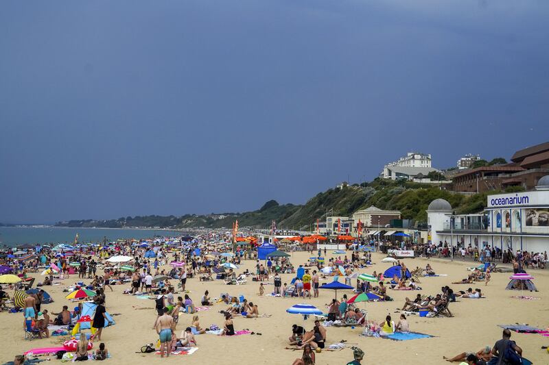 People on the beach in Bournemouth during the record heatwave in July. PA