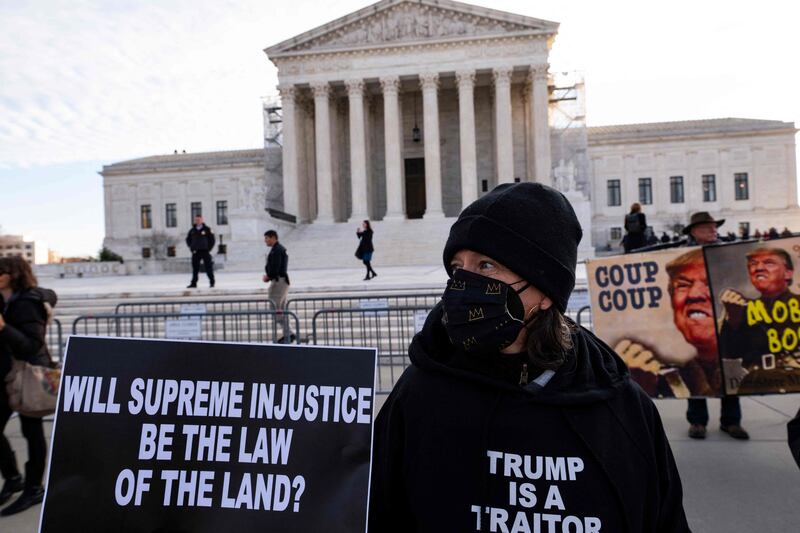 A protest outside the US Supreme Court in Washington this month as it considers whether Donald Trump is eligible to run in the 2024 presidential election. AFP