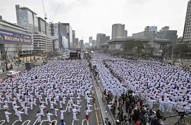 Taekwondo practitioners at a demonstration event at Gwanghwamun Square in Seoul. AFP