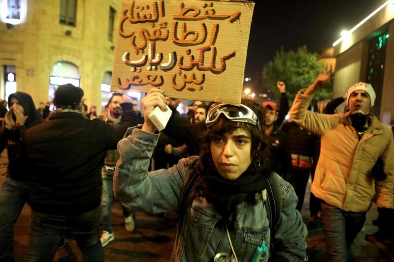 Lebanese anti-corruption protesters shout slogans outside the parliament to denounce the nomination of Prime Minister-designate Hassan Diab in the capital Beirut. AFP