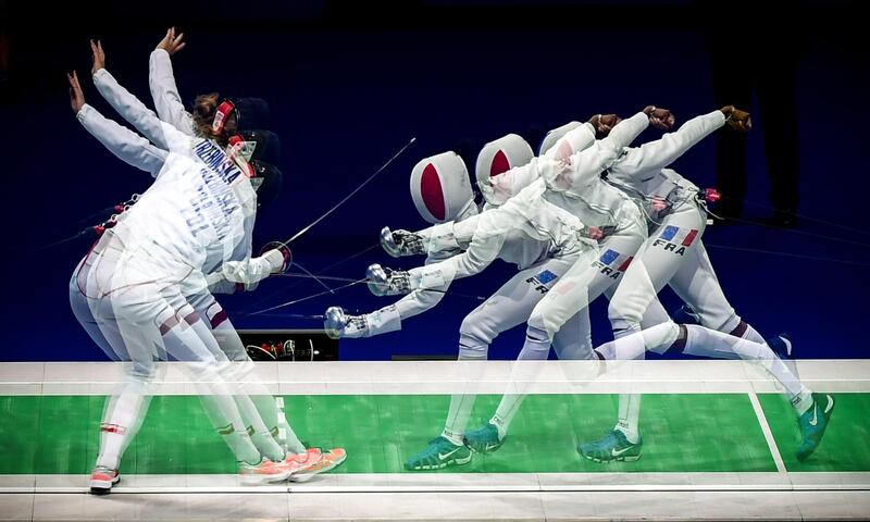 A multiple exposure picture shows fencers compete in the epee women's individual semi-final of the 2019 Fencing European Championships in Duesseldorf, Germany.  EPA