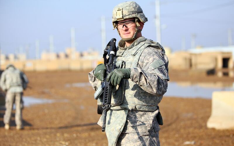 (FILES) In this file photo a US soldier stands at the Taji base complex which hosts Iraqi and US troops and is located thirty kilometres north of the capital Baghdad on December 29, 2014. Washington warned on October 1, 2020 that it would not tolerate attacks on US interests in Iraq by Iran-backed militias, as Baghdad worries about a possible US withdrawal. "We can't tolerate the threats to our people, our men and women serving abroad," David Schenker, assistant secretary of state, for near Eastern affairs, told reporters.
 / AFP / ALI AL-SAADI
