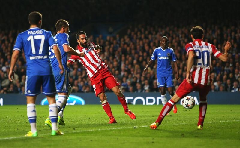 Arda Turan of Atletico Madrid scores his team's third goal during their Champions League victory over Chelsea on Wednesday. Clive Rose / Getty Images / April 30, 2014