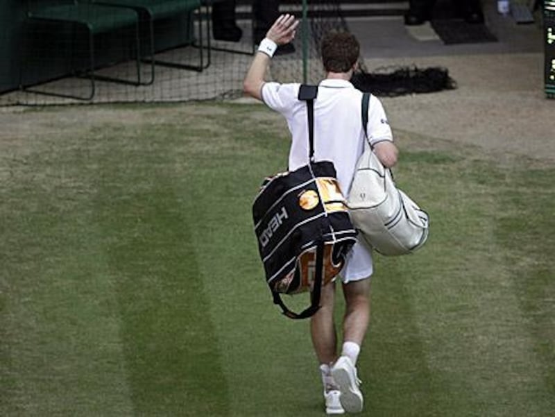 A dejected Andy Murray says goodbye to this year's Wimbledon.