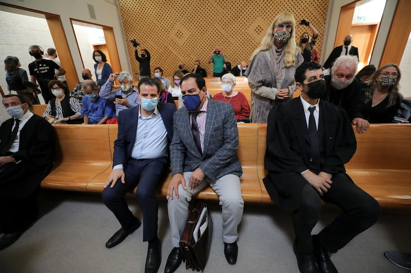 Dr Abuelaish sits next to Arab member of the Israeli parliament Ayman Odeh at the Supreme Court in Jerusalem. Reuters