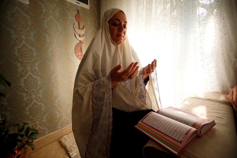 Venus Maythem Abbas prays and reads the Quranin Baghdad. Reuters