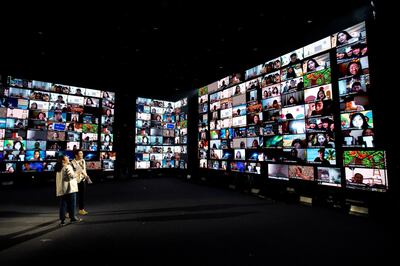 Artists perform in front of screens showing audience via the Zoom application during the first six-hour online music festival at a studio amid the spread of the coronavirus disease (COVID-19) in Bangkok, Thailand, June 7, 2020. REUTERS/Athit Perawongmetha     TPX IMAGES OF THE DAY