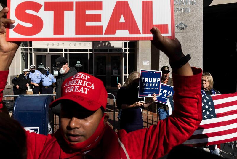 Supporters of President Trump, who are questioning the legitimacy of the state's vote counting, gather outside of the Pennsylvania Convention Centre in Philadelphia. EPA