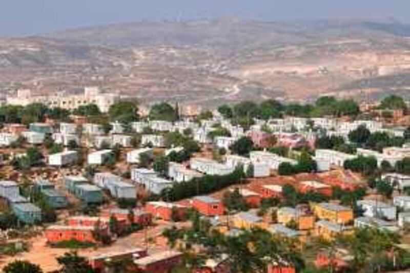 Prefabricated homes are used as dorms to cater for the rapidly  
expanding student population in the illegal settlement of Ariel, deep  
in the West Bank. The decision last week to upgrade Ariel college to  
university status is expected to double the student intake within a  
decade and allow for the settlement's rapid expansion. 



File picture dated August 23, 2009 shows a general view of prefabricated houses for students at a local college in the Jewish settlement of Ariel in the occupied West Bank. Israel will approve construction of hundreds of new homes in West Bank settlements before weighing a freeze sought by Washington in a move announced on September 4 that fuelled Palestinian outrage. AFP PHOTO/YEHUDA RAIZNER