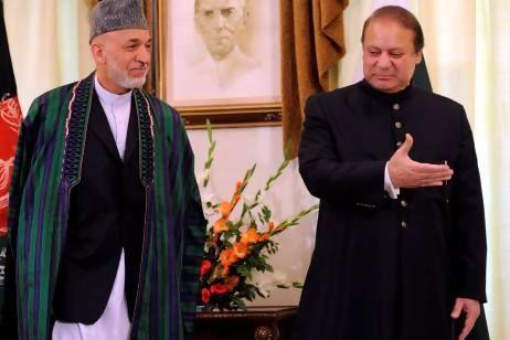Pakistan's prime minister Nawaz Sharif (right) talks with Afghan president Hamid Karzai during their meeting in Islamabad.