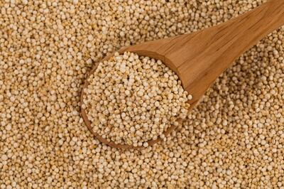 Organic Quinoa (Chenopodium quinoa) seeds in spoon - macro close up background texture. Getty Images