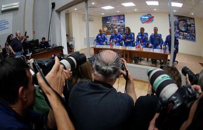 From left, United Arab Emirates astronaut Hazza Al Mansouri, Russian cosmonaut Oleg Skripochka, and U.S. astronaut Jessica Meir, members of the main crew to the International Space Station (ISS), and United Arab Emirates astronaut Sultan Al Neyadi, Russian cosmonaut Sergey Ryzhikov and U.S. astronaut Thomas Marshburn, members of the back up crew attend a news conference trough a safety glass in Russian leased Baikonur cosmodrome, Kazakhstan, Tuesday, Sept. 24, 2019. The new Soyuz mission to the International Space Station (ISS) is scheduled on Wednesday, Sept 25. (AP Photo/Dmitri Lovetsky)