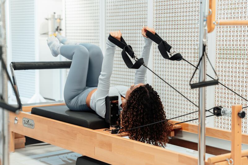 Pilates can be practised in various forms, including with a reformer machine. Photo: Ahmet Kurt / Unsplash