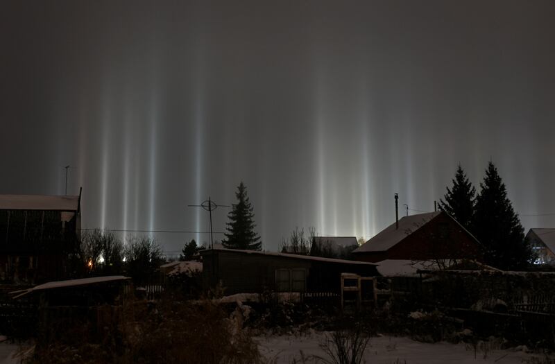 Pillars of light beam up from the ground into the sky in Omsk, Russia. Reuters