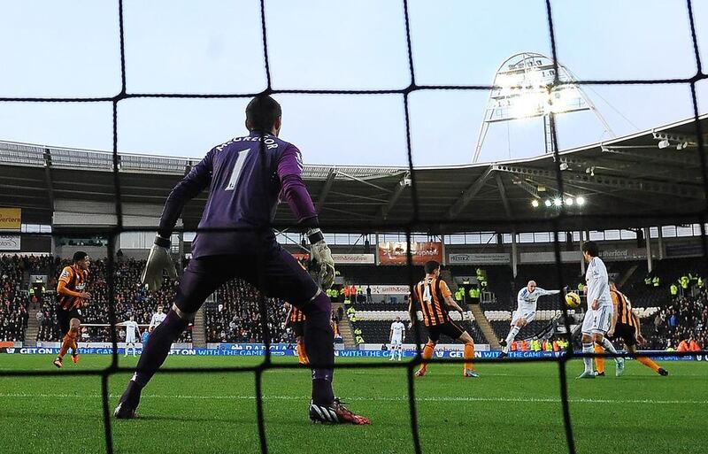 A shot by Jonjo Shelvey of Swansea City is deflected in by Ki Sung-Yeung for the first goal during the match between Hull City and Swansea City at KC Stadium on December 20, 2014 in Hull, England. Nigel Roddis / Getty Images