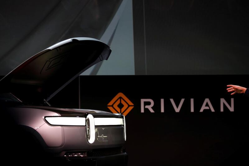FILE PHOTO: R.J. Scaringe, Rivian's 35-year-old CEO, introduces his company's R1T all-electric pickup truck at Los Angeles Auto Show in Los Angeles, California, U.S. November 27, 2018. REUTERS/Mike Blake/File Photo