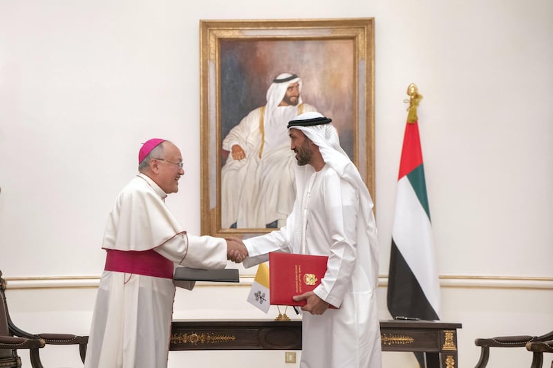 ABU DHABI, UNITED ARAB EMIRATES - November 18, 2019: HE Mohamed Mubarak Al Mazrouei, Undersecretary of the Crown Prince Court of Abu Dhabi (R) greets His Grace Archbishop Francisco Montecillo Padilla, personal envoy of His Holiness Pope Francis (L), after signing of a collaborative declaration on global health, at the Sea Palace.

( Rashed Al Mansoori / Ministry of Presidential Affairs )
---