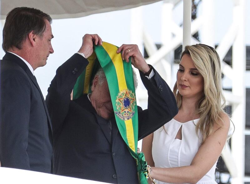 Jair Bolsonaro receives the presidential band from his predecessor, former Brazilian President Michel Temer. EPA