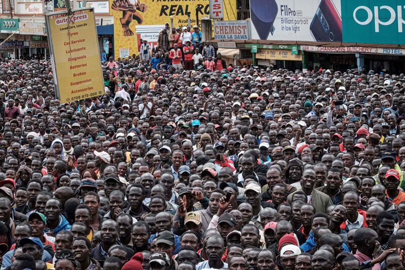 Thousands watch Eliud Kipchoge on a screen in Eldoret, Kenya, as he successfully attempts to break the two-hour barrier for the marathon in the Ineos 1:59 Challenge that was staged in Vienna on Sunday, October 12. AFP