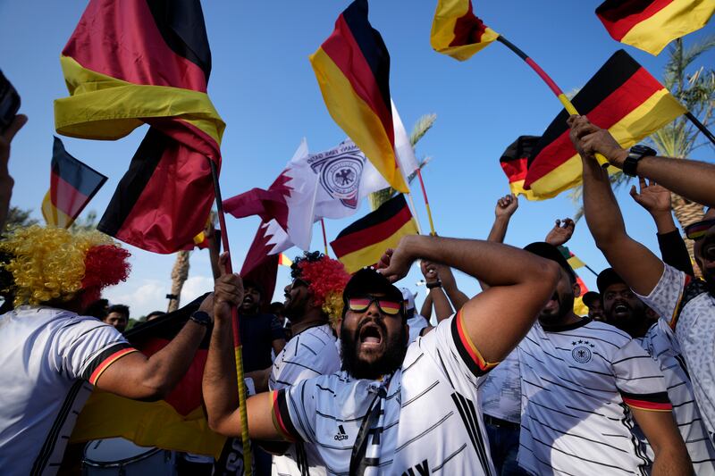 German fans cheer at flag plaza in Doha, Qatar.  Final preparations are being made for the soccer World Cup which starts on Nov.  20 when Qatar face Ecuador.  AP