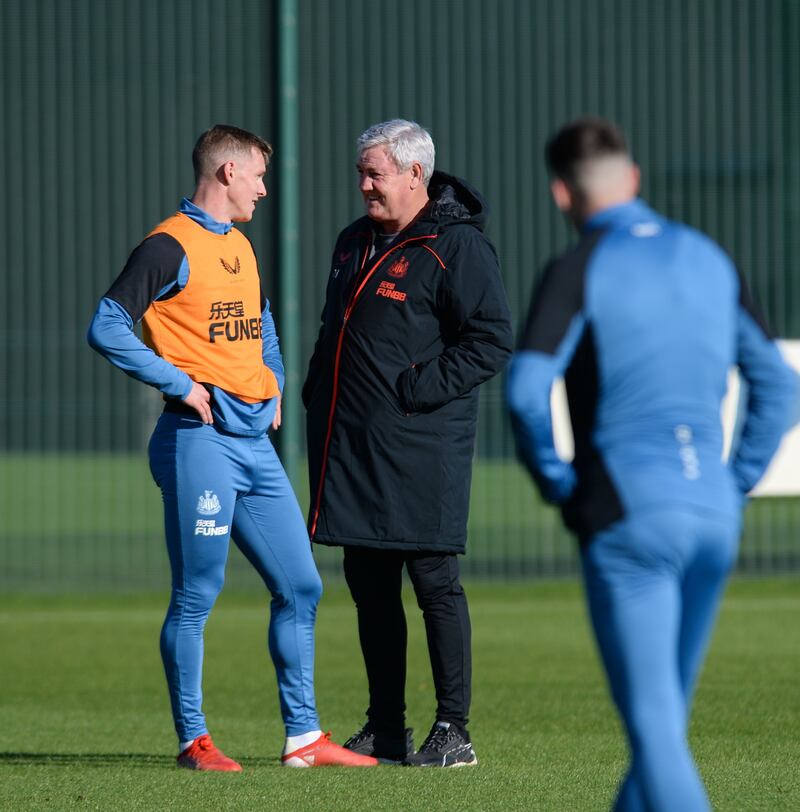 Newcastle United coach Steve Bruce speaks to Emil Krafth at training ahead of their match against Tottenham. All pictures Getty