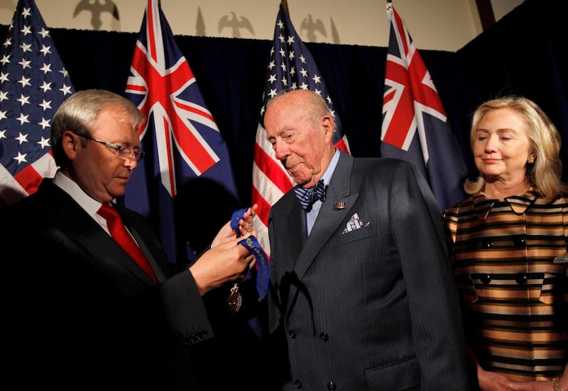 US Secretary of State Hillary Clinton looks on as former Secretary of State George Shultz is given the Honorary Order of Australia by Australian Foreign Minister Kevin Rudd during the Australia-United States Ministerial Consultations in San Francisco, California on September 14, 2011. Reuters