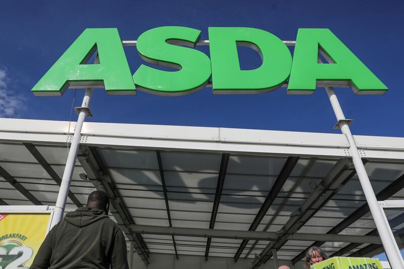 An Asda logo stands above the entrance to an Asda supermarket, operated by Walmart Inc., in London, U.K., on Monday, Sept. 28, 2020. Walmart Inc. has picked a consortium backed by TDR Capital as the preferred bidder for a majority stake in its U.K. grocery unit Asda, people with knowledge of the matter said. Photographer: Simon Dawson/Bloomberg