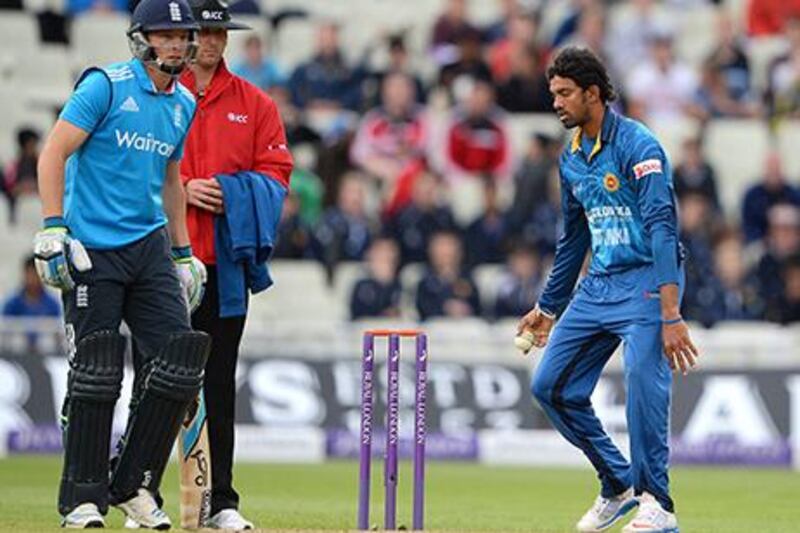 Jos Buttler, left, was run out for failing to back up at the non-striker's crease in an ODI against Sri Lanka. Andrew Yates / AFP