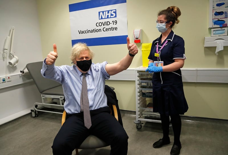 Britain's Prime Minister Boris Johnson gestures after receiving the first dose of the AstraZeneca vaccine at St.Thomas' Hospital in London in March this year. AP Photo