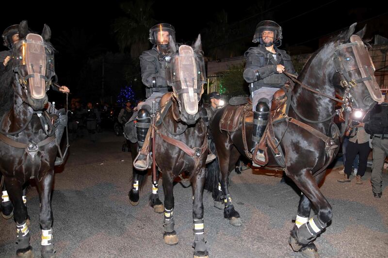 Israeli mounted police move to disperse Palestinian protesters amid ongoing confrontations as Palestinian families face eviction in the Sheikh Jarrah neighbourhood of East Jerusalem. AFP