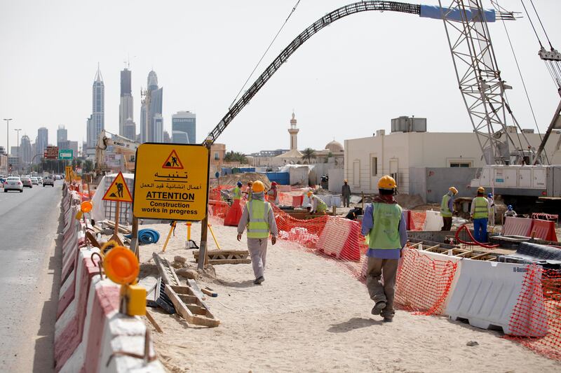 Dubai, April 23 2013 - Workers lay rail in Al Safouh for the upcoming Al Safouh Tram Project in Dubai, April 23, 2013. (Photo by: Sarah Dea/The National)

