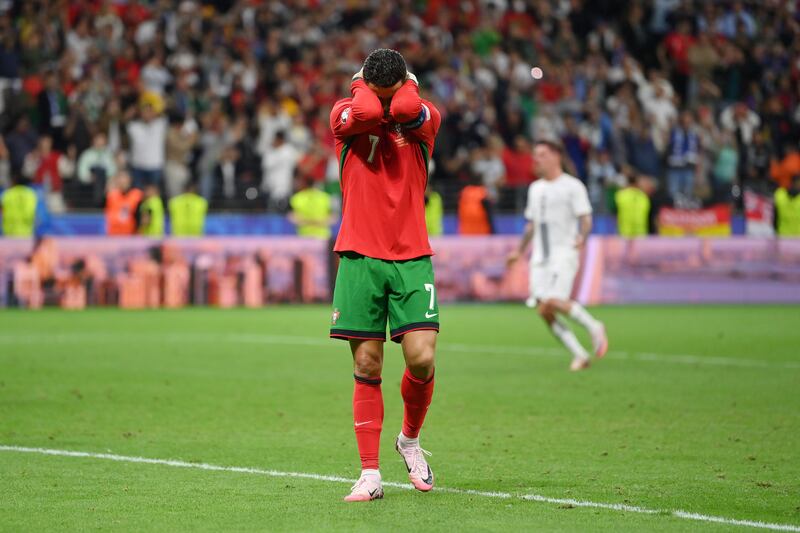Cristiano Ronaldo of Portugal reacts after Slovenia goalkeeper Jan Oblak saves his penalty. Getty Images