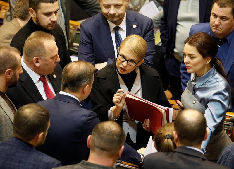 Ukrainian opposition leader Yulia Tymoshenko speaks with lawmakers before a parliament session to review a proposal by Ukrainian President Petro Poroshenko to introduce martial law for 60 days after Russia seized Ukrainian naval ships off the coast of Russia-annexed Crimea, in Kiev, Ukraine November 26, 2018. REUTERS/Valentyn Ogirenko