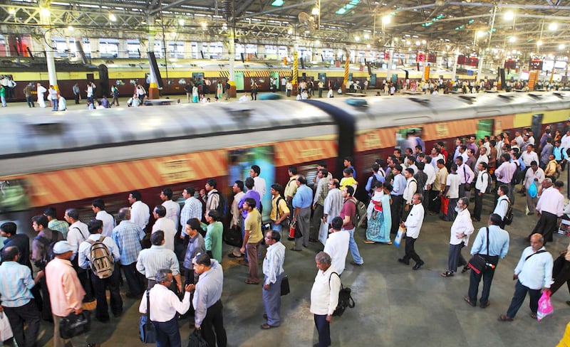 Mumbai , INDIA :
Commuters wait for Suburban Trains at the CST Train station formerly known as the Victoria Terminus at Mumbai. It is one of the busiest railway stations in India & the trains runs over crowded.

(Subhash Sharma for The National)