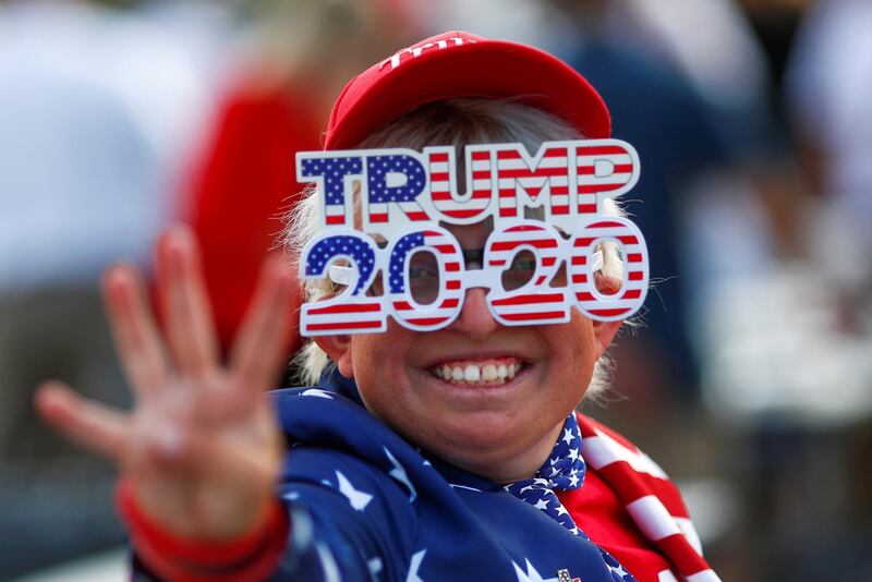 A supporter gestures before a campaign rally from Donald Trump Jr for US President Donald Trump ahead of the Election Day, in Scottsdale, Arizona, November 2, 2020. Reuters