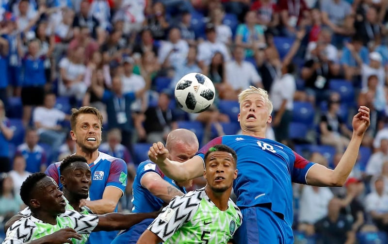 Iceland's Hordur Magnusson goes for a header during the match against Nigeria. Sergei Ilnitsky / EPA