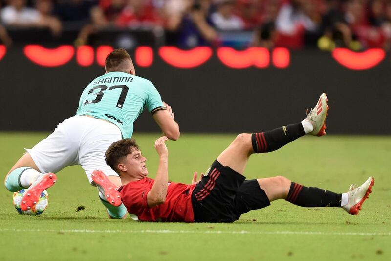 Daniel James hits the turf challenging Inter's Milan Skriniar. AFP