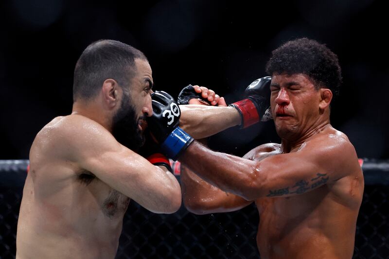 Belal Muhammad and Gilbert Burns exchange punches during their welterweight bout at UFC 288. Getty