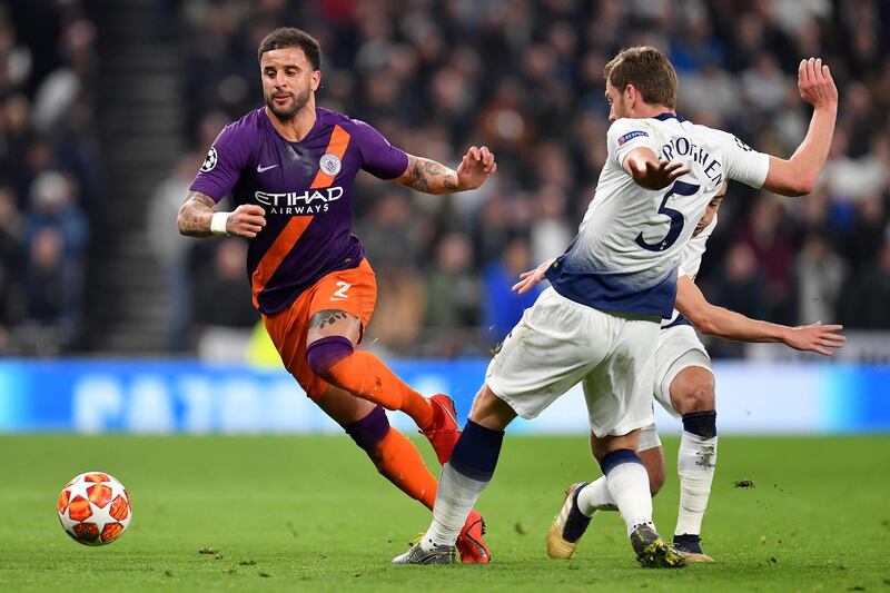 Manchester City's Kyle Walker is tackled by Tottenham's Jan Vertonghen. Getty Images