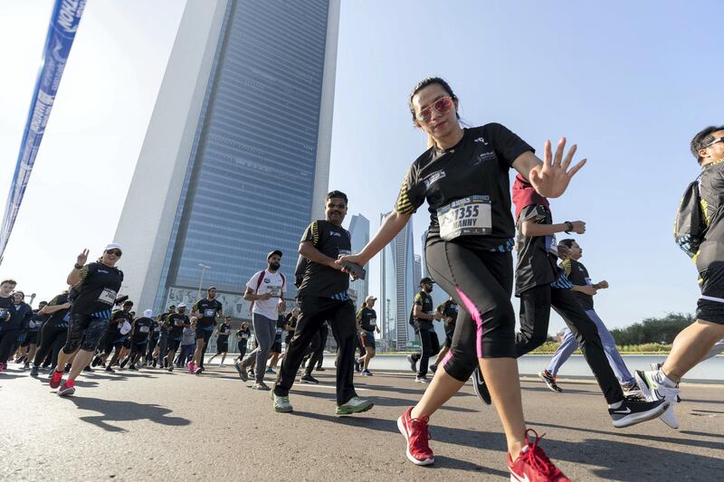 Abu Dhabi, United Arab Emirates - December 06, 2019: Athletes run the 5K the ADNOC Abu Dhabi marathon 2019. Friday, December 6th, 2019. Abu Dhabi. Chris Whiteoak / The National