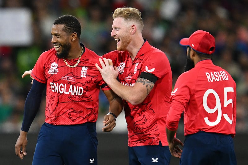 England's Chris Jordan celebrates with teammate Ben Stokes after dismissing Pakistan's Shadab Khan. PA