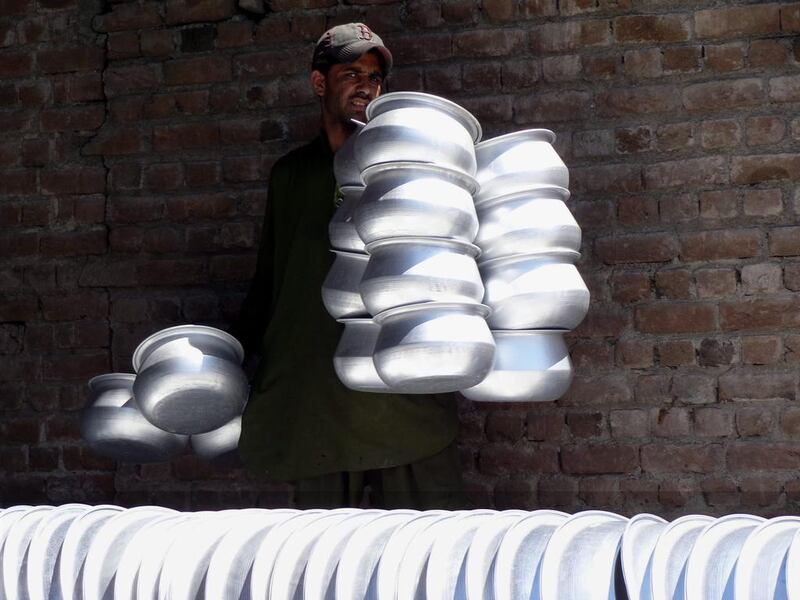 An Afghan man works at an aluminium factory in Nangarhar, Afghanistan. Ghulamullah Habibi / EPA