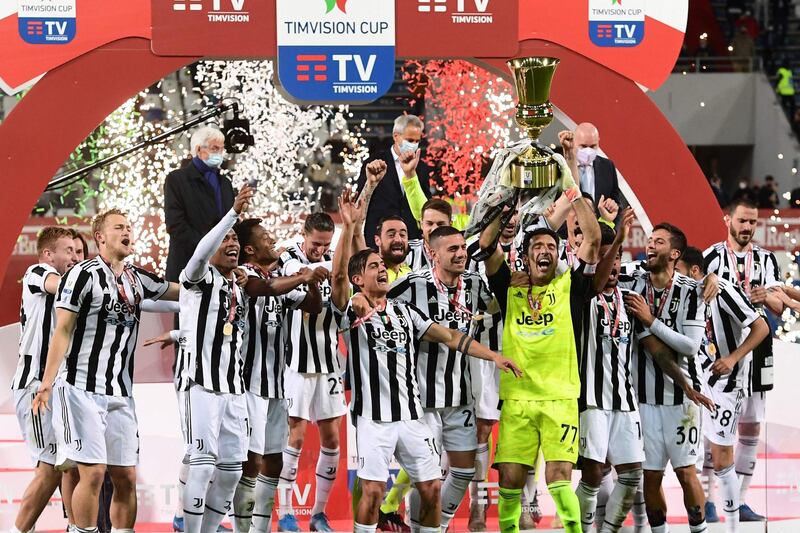 Juventus' Italian goalkeeper Gianluigi Buffon holds the winner's trophyafter winning the final of the Coppa Italia against Atalanta. AFP