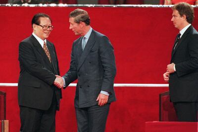 Chinese President Jiang Zemin with Prince Charles in 1997 as Britain's Prime Minister Tony Blair looks on during the handover ceremony of Hong Kong from British to Chinese rule. AFP