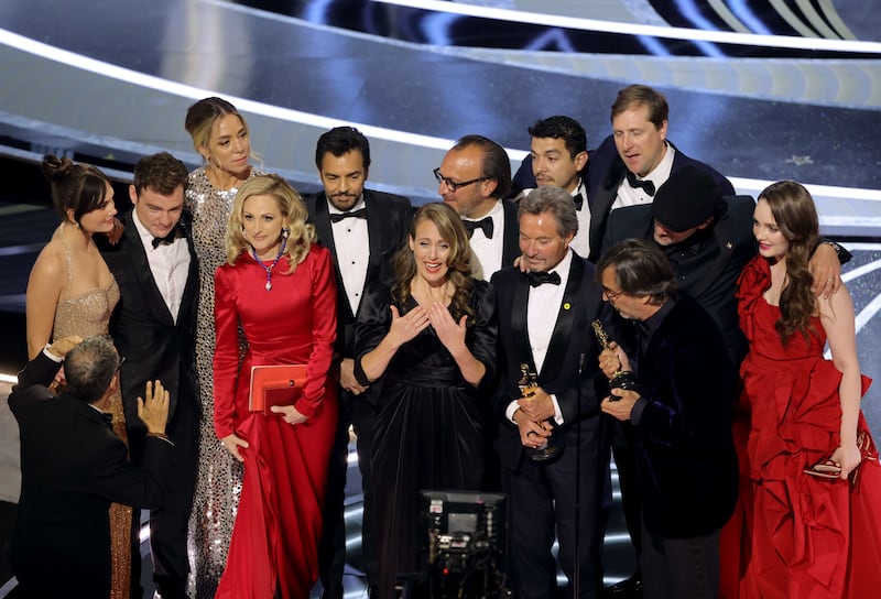 From left, Emilia Jones, Daniel Durant, Sian Heder, Marlee Matlin, Eugenio Derbez, Fabrice Gianfermi, Patrick Wachsberger, Justin Maurer, Philippe Rousselet, Troy Kotsur and Amy Forsyth accept the Best Picture award for ‘Coda’ on stage during the 94th Annual Academy Awards at Dolby Theatre in Hollywood, California. AFP