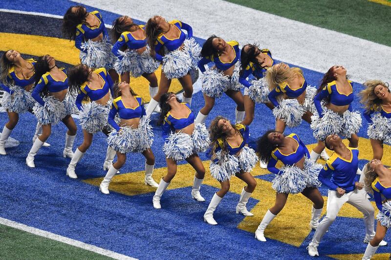 Rams cheerleader Napoleon Jinnies (bottom R) perform with other cheerleaders during Super Bowl LIII between the New England Patriots and the Los Angeles Rams at Mercedes-Benz Stadium in Atlanta, Georgia, on February 3, 2019. (Photo by Angela Weiss / AFP)