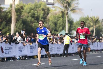 DUBAI, UNITED ARAB EMIRATES - Jan 26, 2018. 

Runners arriving at the finish line at the Standard Chartered Dubai Marathon. 

(Photo by Reem Mohammed/The National)

Reporter: Amith
Section: NA + SP