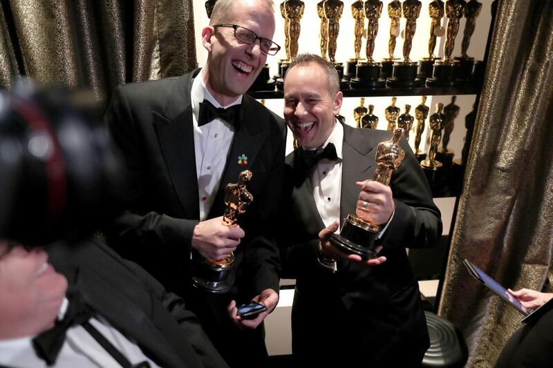 Pete Docter and producer Jonas Rivera winners of the Best Animated Feature Film award for Inside Out backstage. AFP
