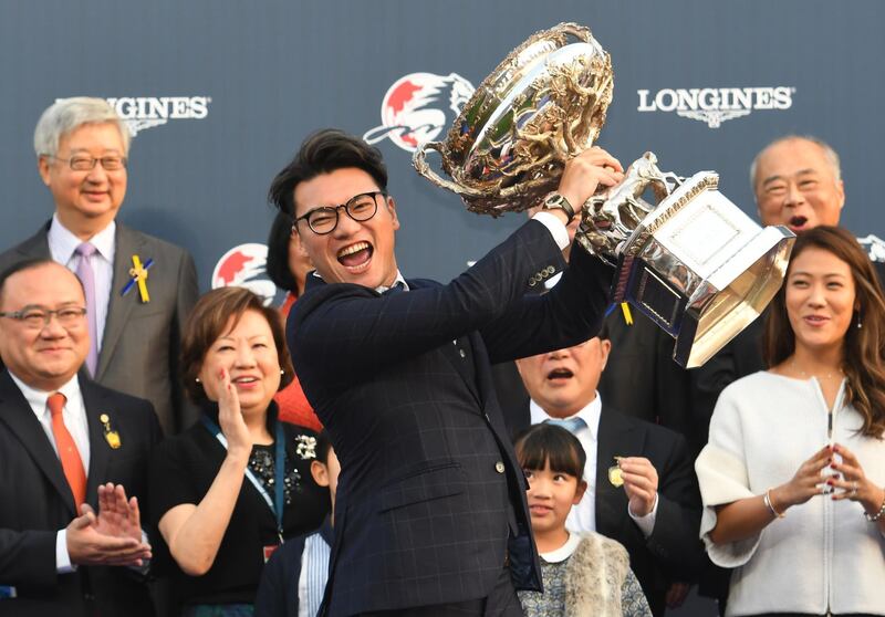 Winning owner Martin Siu Kim Sun holds the cup after Time Warp won Race 8, The Longines Hong Kong Cup during Longines Hong Kong International Race Day in Hong Kong.  Vince Caligiuri / Getty Images